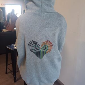 A picture of a hoodie with a heart on it.